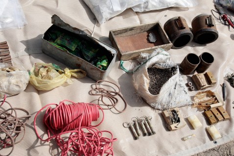 Explosive devices, steel ball bearings and wires are displayed today at a military base after they were found two days ago near the Shiite village of Jadidah, 15 miles north of Baghdad.